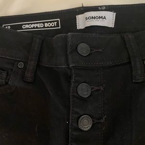 Black, button fly, cropped boot cut Jeans